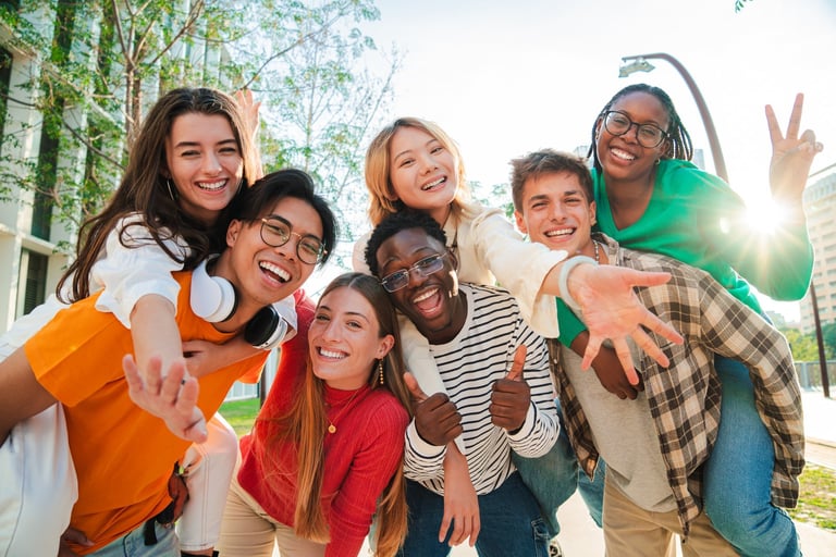 Happy diverse group of teenagers smiling together