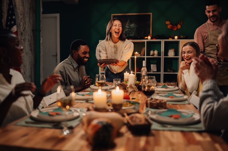 Happy diverse friends enjoying a festive meal together